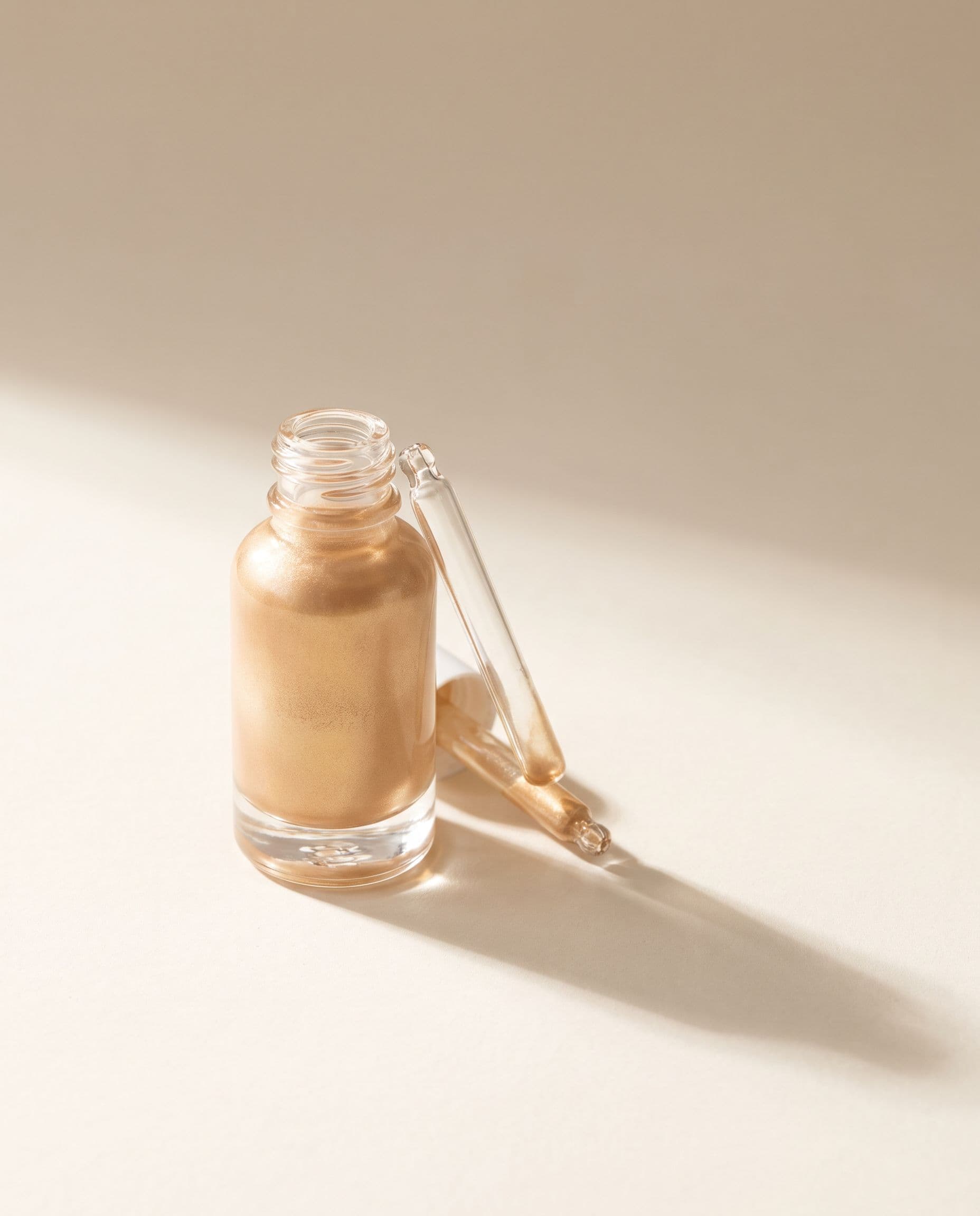 Solstice — liquid highlighter in warm gold